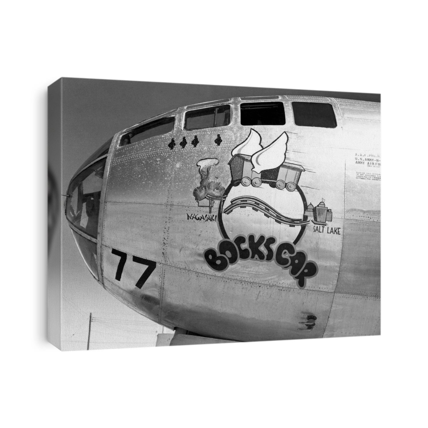 Bockscar Boeing B-29 aircraft. This is the nosecone and cockpit of Bockscar, the B-29 bomber that dropped the Fat Man atomic bomb over Nagasaki, Japan, on 9 August 1945. The names of the cities of Nagasaki and Salt Lake are part of the nosecone artwork (added after the mission), with a winged boxcar carrying the atomic bomb from Salt Lake City (where the plane entered service) to Nagasaki. This plane was retired in 1946, and is now displayed at the National Museum of the United States Air Force, at Wright-Patterson Air Force Base, Ohio, USA.